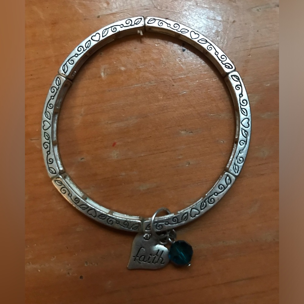 Silver faith bracelet and stretches! I wore it once, I just don’t wear jewelry
